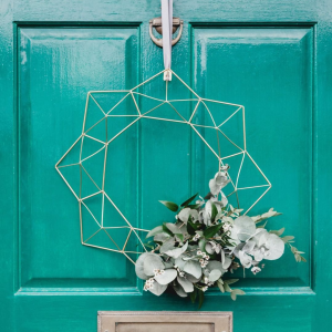 Wreaths aren't just for Christmas-time! Get crafty and add a welcoming touch to your front door throughout the year with seasonal decor. Do you keep a wreath up year-round? photo